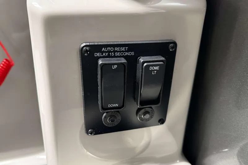 Slide: The Image of Control panel of 2026 Sylvan Mirage 8520 CLZ DH with switches for dome light and auto reset. - 12