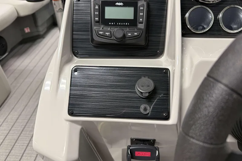 Slide: The Image of Dashboard of 2026 Sylvan Mirage 8520 CLZ DH with audio controls and gauges. - 13