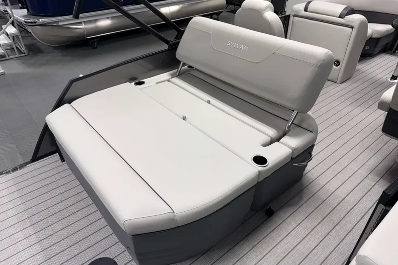 Slide: The Image of 2026 Sylvan Mirage 8520 CLZ DH boat interior with plush seating and cup holders. - 15