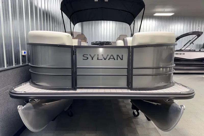 Slide: The Image of 2026 Sylvan Mirage 8520 CLZ DH pontoon boat in a showroom setting. - 18