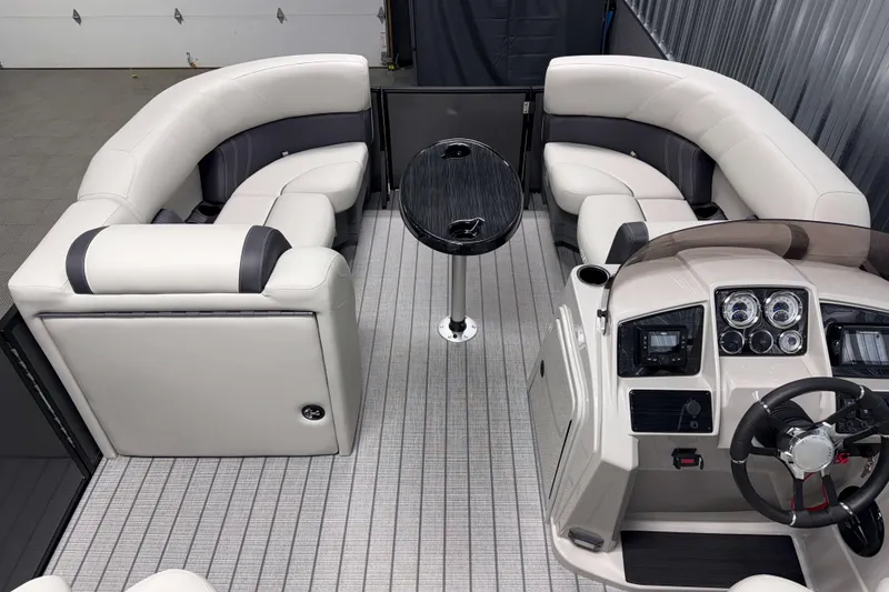 Slide: The Image of Luxurious interior of 2026 Sylvan Mirage 8520 CLZ DH pontoon boat with plush seating and modern dashboard. - 4