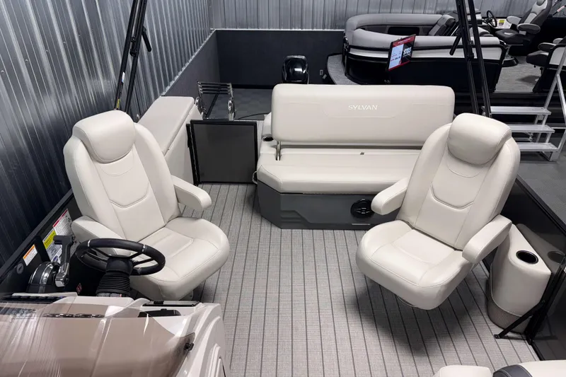 Slide: The Image of 2026 Sylvan Mirage 8520 CLZ DH pontoon boat interior with plush seating and modern design. - 5