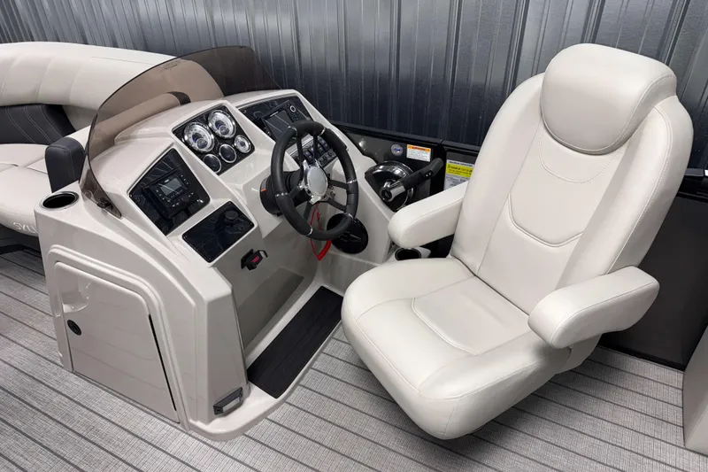 Slide: The Image of 2026 Sylvan Mirage 8520 CLZ DH boat helm with modern controls and comfortable captain's chair. - 7