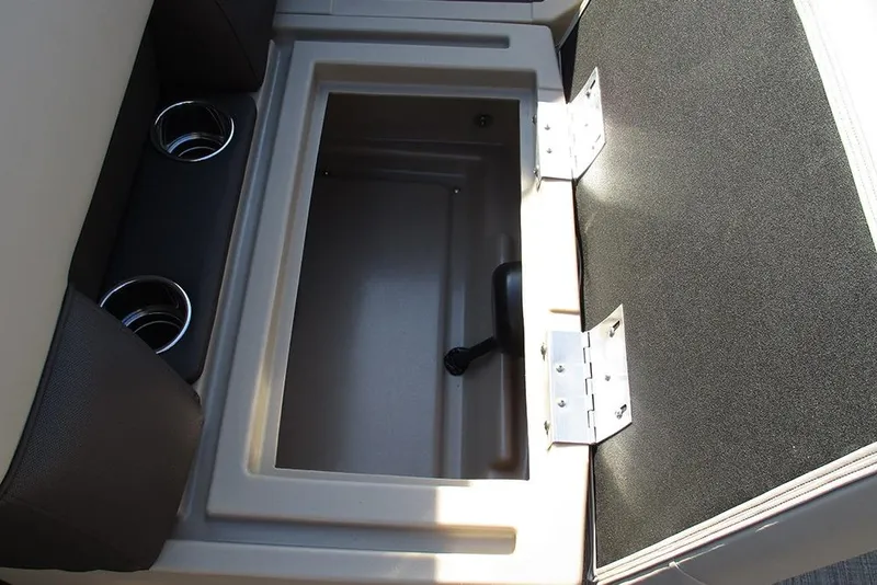 Slide: The Image of Open storage compartment with cup holders on a 2026 Bentley Pontoons Fish 243 N-Cruise. - 12