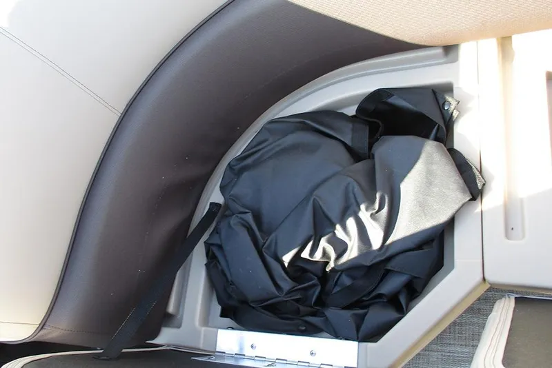 Slide: The Image of Storage compartment in 2026 Bentley Pontoons Fish 243 N-Cruise boat. - 17