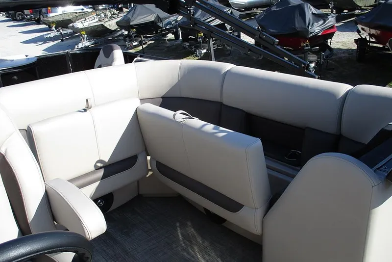 Slide: The Image of 2026 Bentley Pontoons Fish 243 N-Cruise interior with beige seating and modern design. - 20