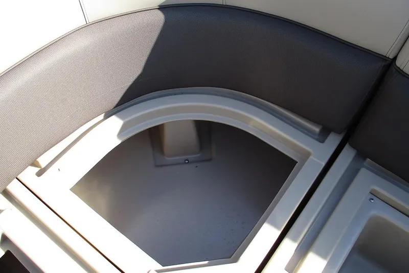 Slide: The Image of 2026 Bentley Pontoons Fish 243 N-Cruise storage compartment with cushioned seating. - 25
