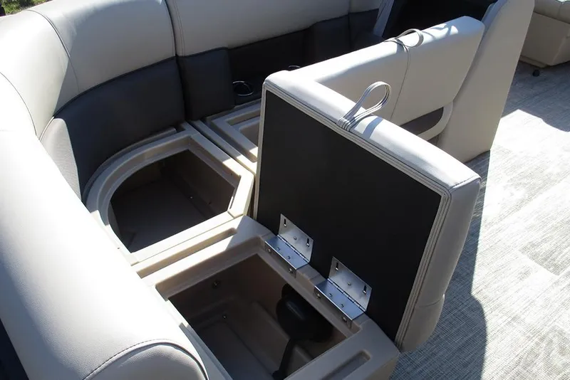 Slide: The Image of 2026 Bentley Pontoons Fish 243 N-Cruise interior seating with storage compartments open. - 26