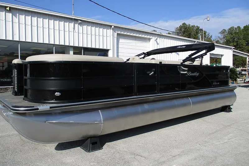 Slide: The Image of 2026 Bentley Pontoons Fish 243 N-Cruise pontoon boat displayed outdoors. - 3