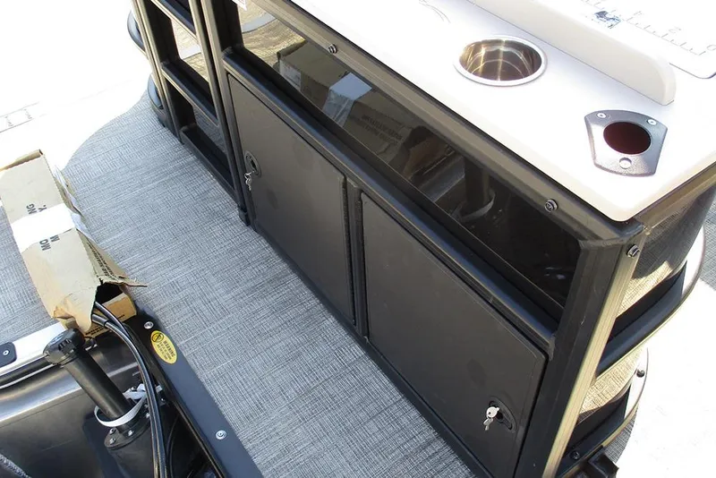 Slide: The Image of 2026 Bentley Pontoons Fish 243 N-Cruise interior with storage and cup holder. - 32