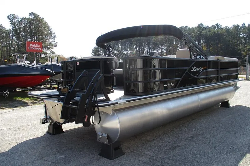 Slide: The Image of 2026 Bentley Pontoons Fish 243 N-Cruise pontoon boat parked outdoors. - 7