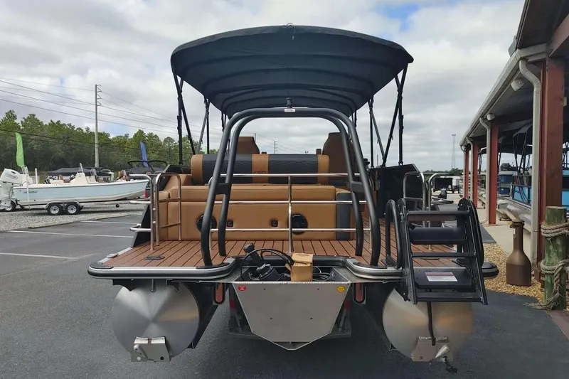 Slide: The Image of 2026 Bentley Pontoons Elite 253 Swingback in a garage, showcasing sleek design and luxury features. - 3