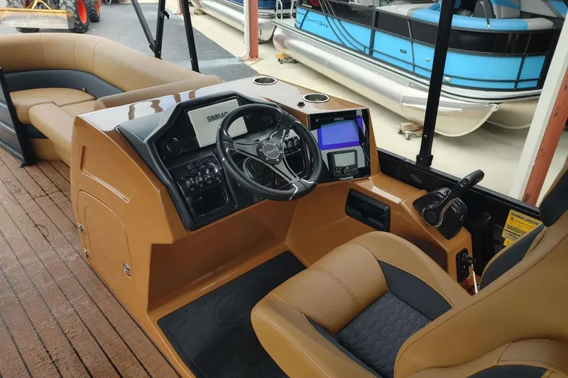 Slide: The Image of 2026 Bentley Pontoons Elite 253 Swingback interior with modern helm and luxurious seating. - 4
