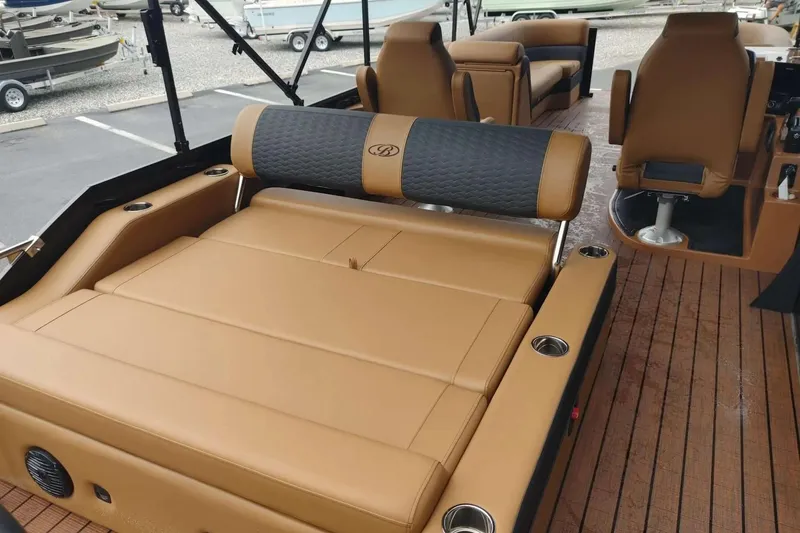 Slide: The Image of 2026 Bentley Pontoons Elite 253 Swingback with luxurious tan seating and modern design. - 5