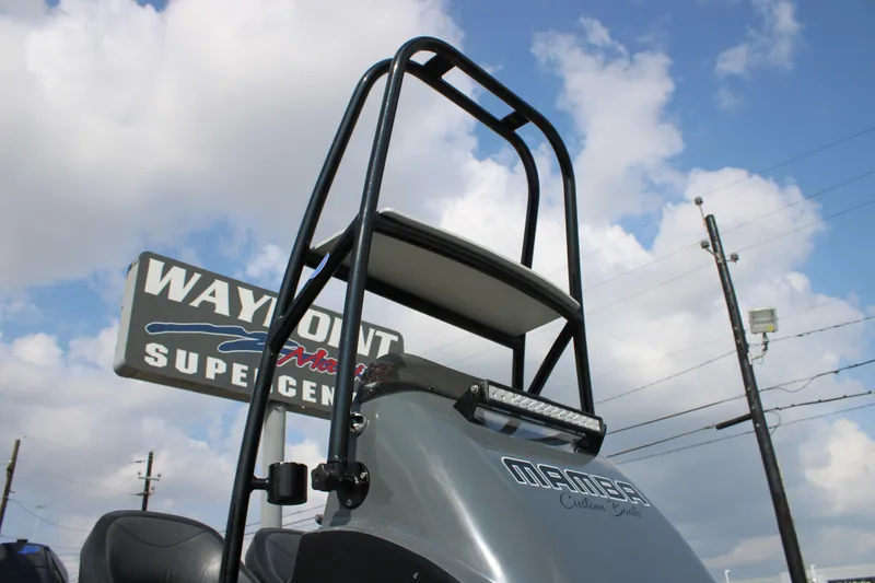 Slide: The Image of 2025 Mamba 24 Cat Classic boat with Waypoint Marine branding, displayed at a marine supercenter. - 14