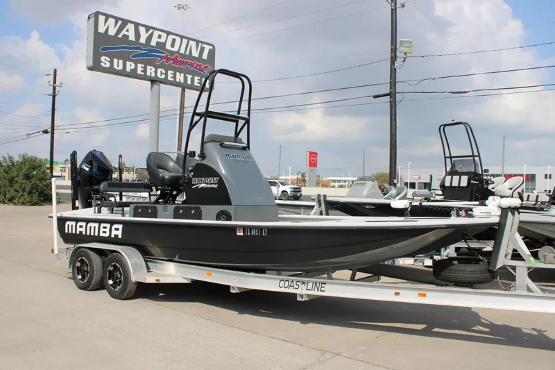 Slide: The Image of 2025 Mamba 24 Cat Classic boat with tower, under a blue sky at Waypoint Marine. - 15