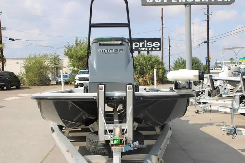 Slide: The Image of 2025 Mamba 24 Cat Classic boat on trailer at dealership. - 16