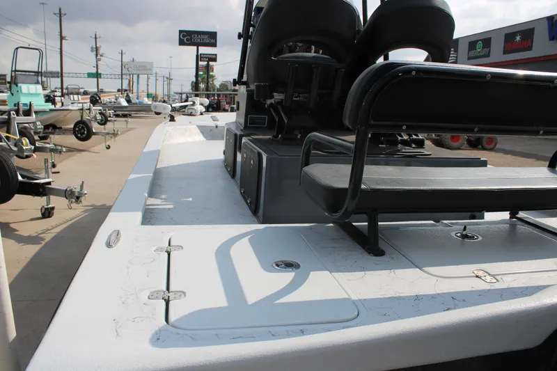 Slide: The Image of 2025 Mamba 24 Cat Classic boat deck with trolling motor and storage compartments. - 3