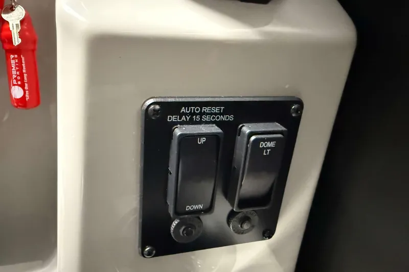 Slide: The Image of Control panel of 2026 Sylvan Mirage 8520 LZ with switches and keychain. - 12