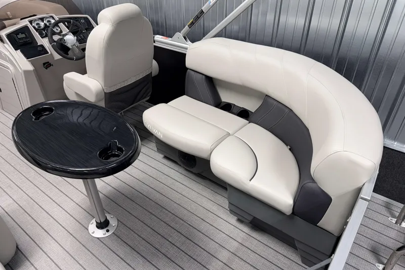 Slide: The Image of Luxurious interior of 2026 Sylvan Mirage 8520 LZ pontoon boat with plush seating and table. - 14