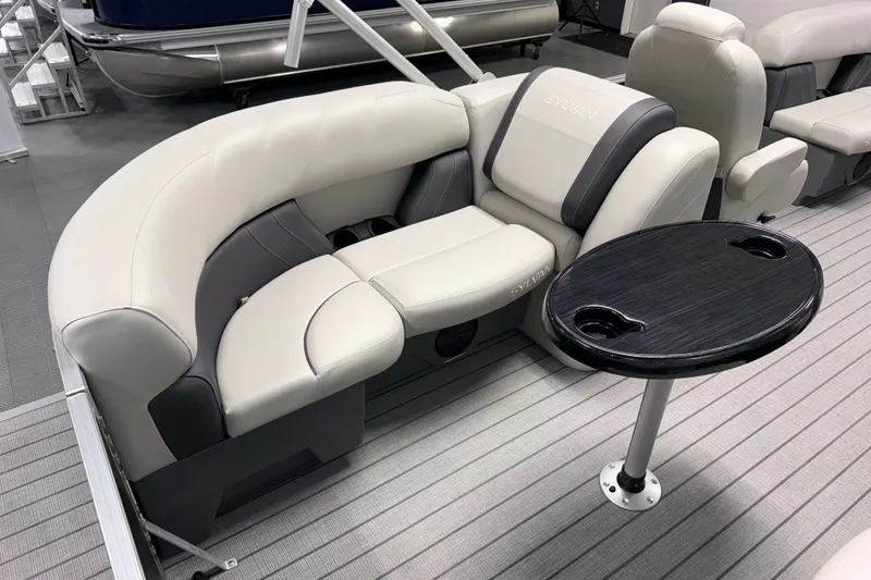 Slide: The Image of Luxurious seating on 2026 Sylvan Mirage 8520 LZ pontoon boat with sleek table design. - 15