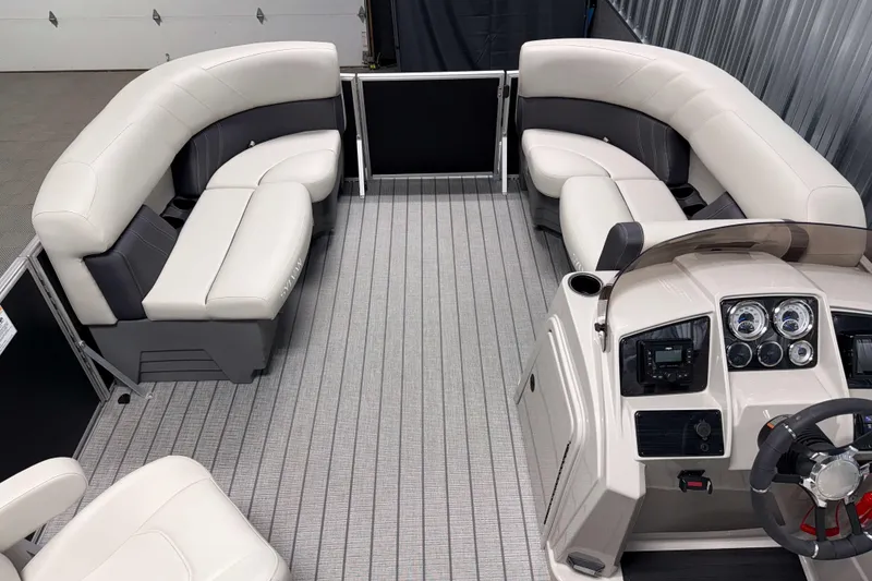Slide: The Image of 2026 Sylvan Mirage 8520 LZ pontoon boat interior with plush seating and modern dashboard. - 4