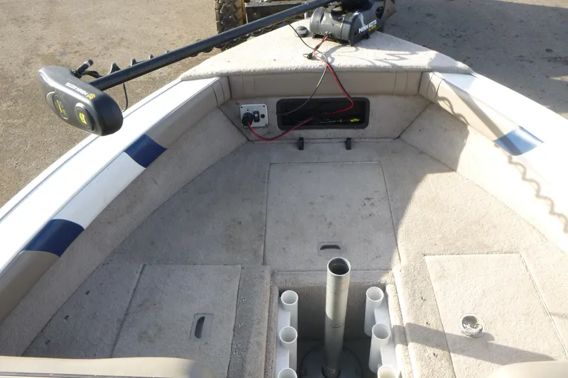 Slide: The Image of 2012 Smoker Craft Ultima 172 boat interior with trolling motor and rod holders. - 16