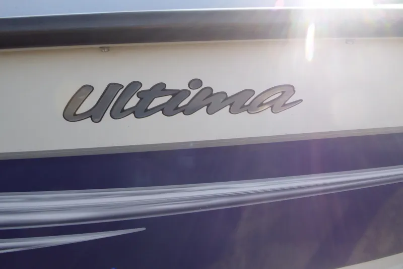 Slide: The Image of 2012 Smoker Craft Ultima 172 boat with sunlight reflecting on the nameplate. - 5