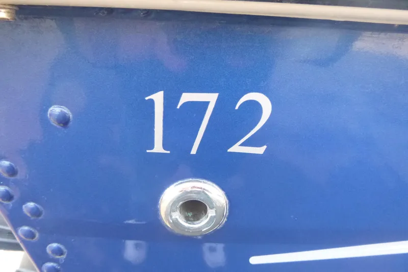 Slide: The Image of Blue Smoker Craft Ultima 172 boat, model year 2012, with visible number "172". - 6