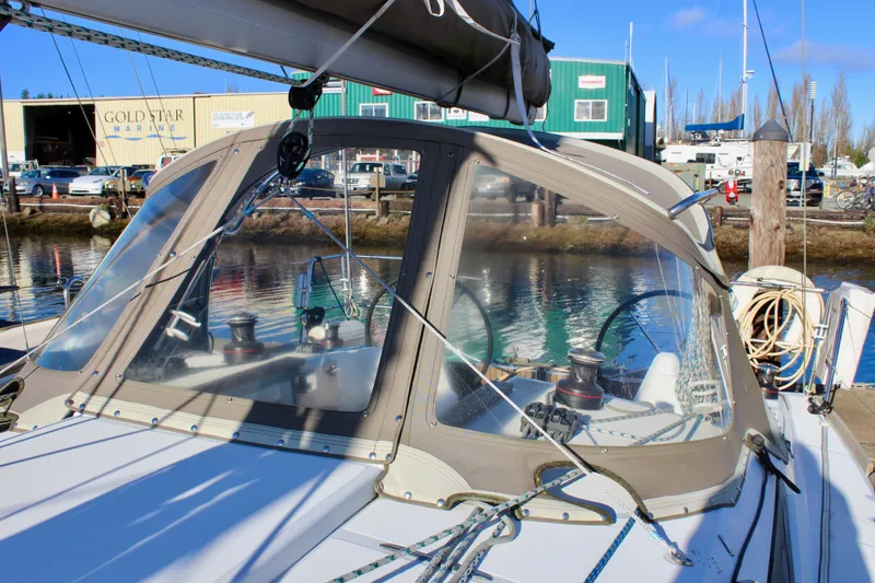 Slide: The Image of 2015 Jeanneau Sun Odyssey 349 sailboat docked at marina, clear canopy, sunny day. - 18