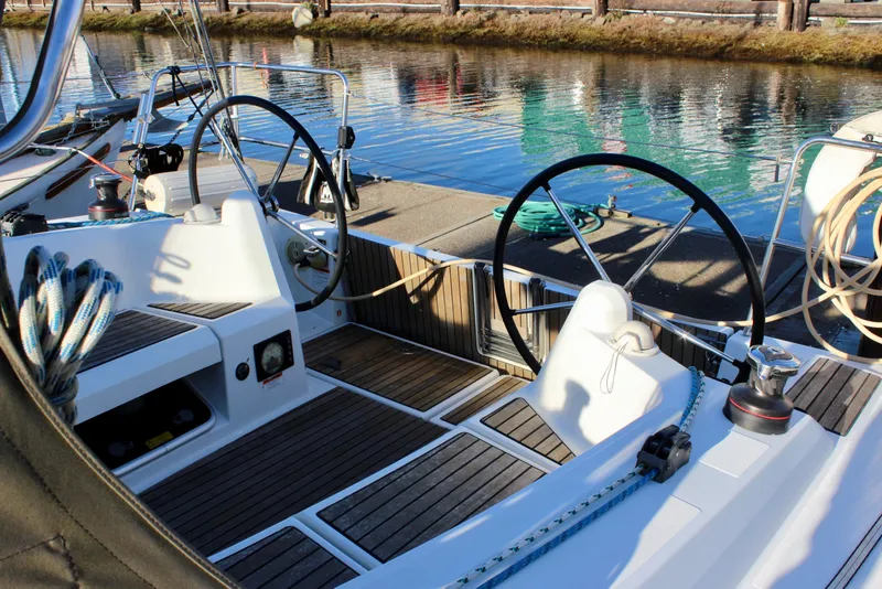 Slide: The Image of Cockpit of 2015 Jeanneau Sun Odyssey 349 sailboat with dual steering wheels. - 19