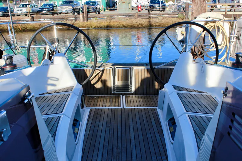 Slide: The Image of Cockpit of 2015 Jeanneau Sun Odyssey 349 sailboat with dual steering wheels. - 20
