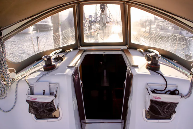 Slide: The Image of Cockpit view of 2015 Jeanneau Sun Odyssey 349 sailboat, featuring winches and nautical equipment. - 27