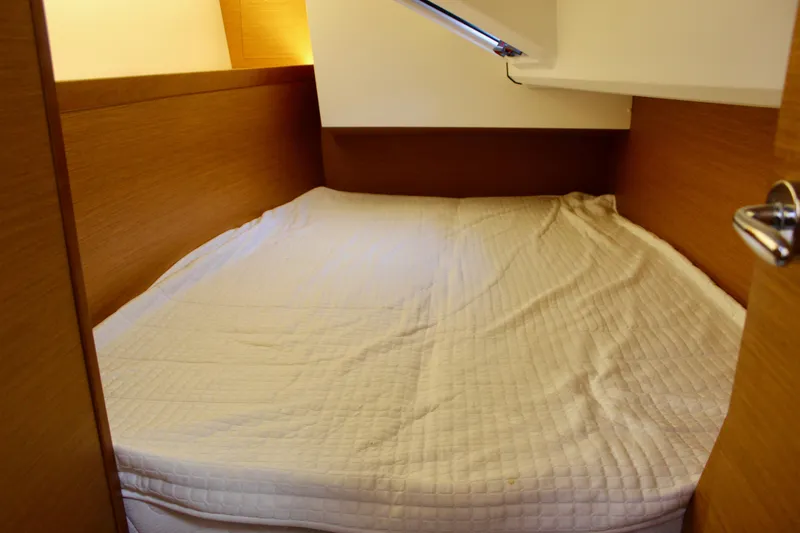 Slide: The Image of Cozy cabin bed in 2015 Jeanneau Sun Odyssey 349 sailboat interior. - 36