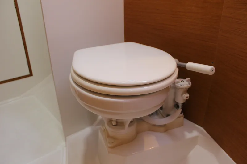 Slide: The Image of Marine toilet in 2015 Jeanneau Sun Odyssey 349 sailboat bathroom. - 43