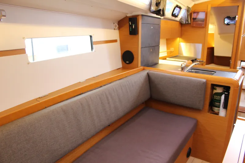 Slide: The Image of Interior of 2015 Jeanneau Sun Odyssey 349 sailboat with cozy seating and modern kitchen. - 55