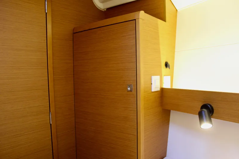 Slide: The Image of Interior of 2015 Jeanneau Sun Odyssey 349 yacht with wooden cabinetry and lighting. - 64