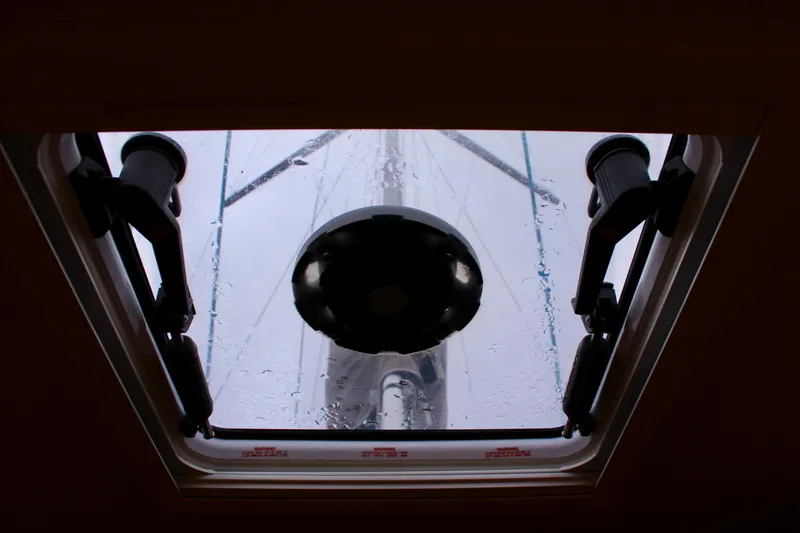 Slide: The Image of Hatch view from Jeanneau Sun Odyssey 349, 2015 model, showing mast and rain droplets. - 67