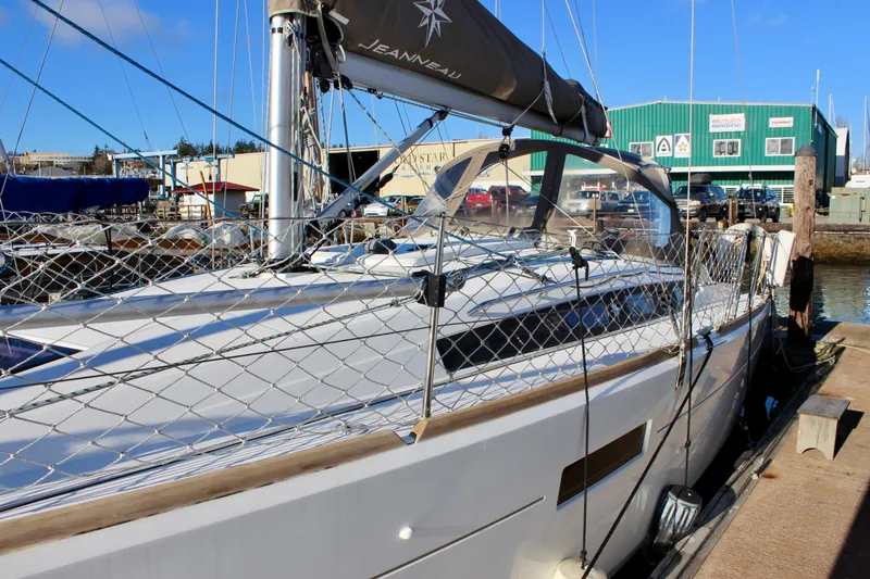 Slide: The Image of 2015 Jeanneau Sun Odyssey 349 sailboat docked at marina, sunny day. - 7
