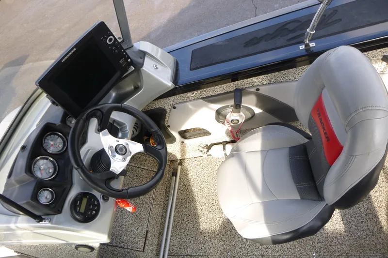 Slide: The Image of 2016 Tracker Targa V-18 WT boat interior with steering wheel and control panel. - 11