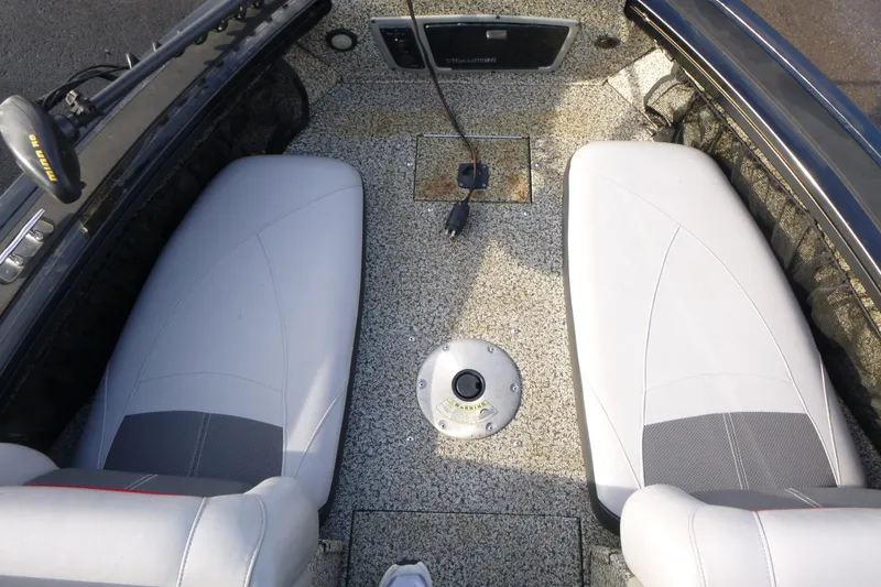Slide: The Image of 2016 Tracker Targa V-18 WT boat interior with gray seating and textured flooring. - 14