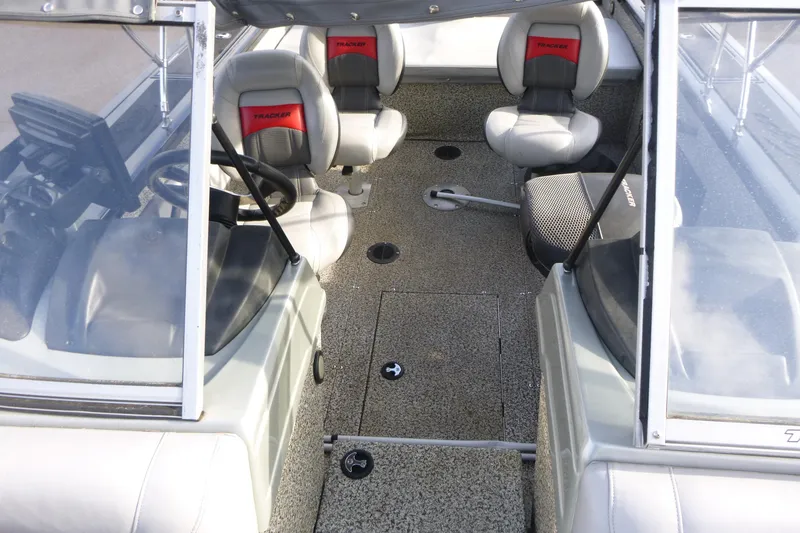 Slide: The Image of 2016 Tracker Targa V-18 WT boat interior with seating and steering wheel. - 17