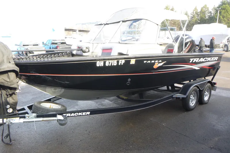 Slide: The Image of 2016 Tracker Targa V-18 WT boat on trailer, parked outdoors. - 3