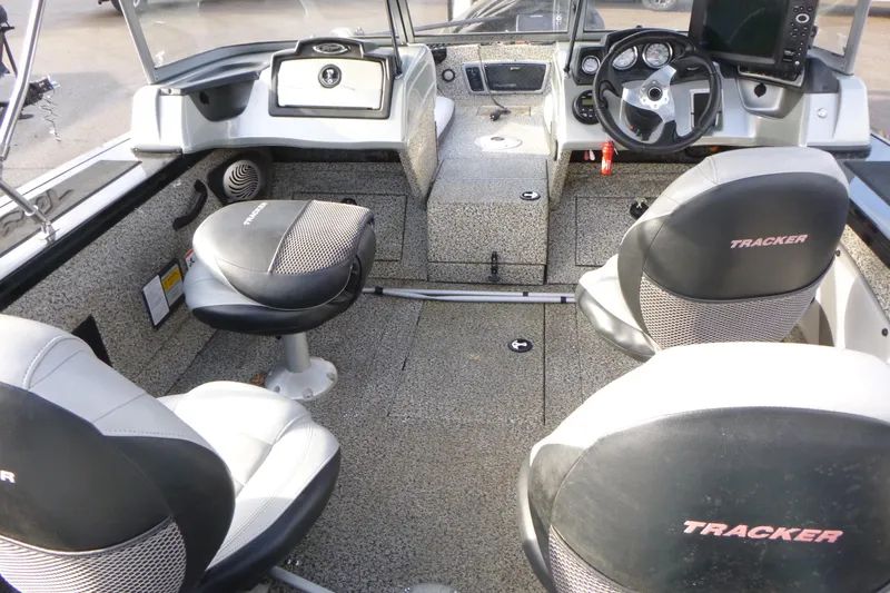 Slide: The Image of 2016 Tracker Targa V-18 WT boat interior with seating and control panel. - 5