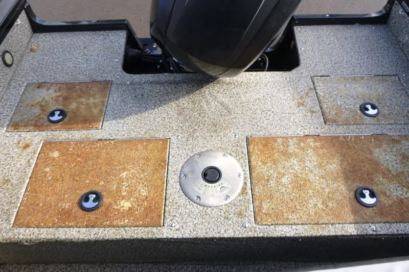 Slide: The Image of 2016 Tracker Targa V-18 WT boat deck with storage compartments and motor. - 8