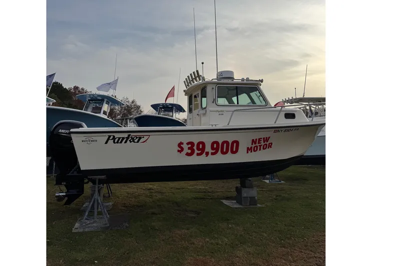 Slide: The Image of 2004 Parker 2120 Sport Cabin boat for sale, priced at $39,900 with new motor. - 2