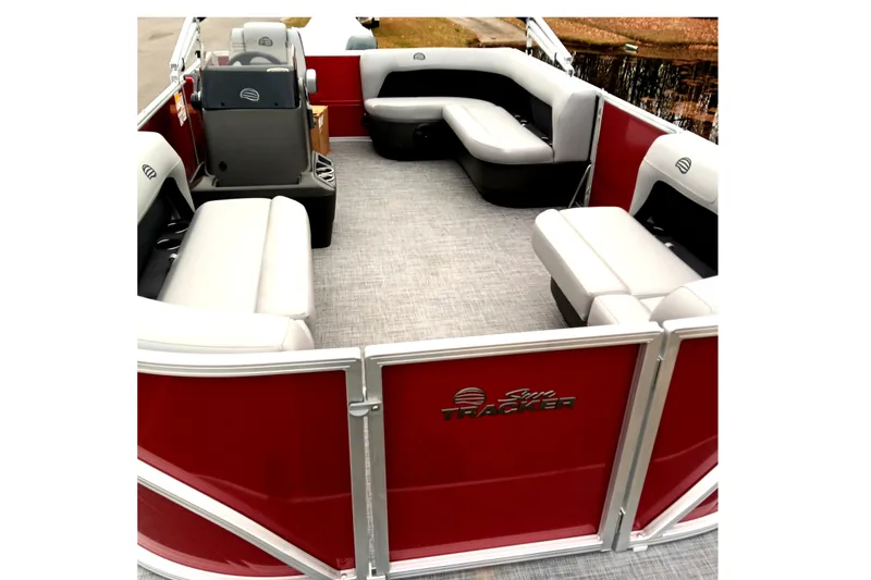 Slide: The Image of 2026 Sun Tracker Party Barge 16 DLX interior with red exterior and comfortable seating. - 10