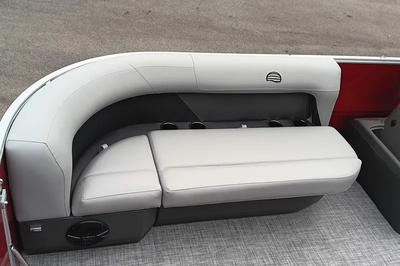 Slide: The Image of 2026 Sun Tracker Party Barge 16 DLX interior seating with cup holders and modern design. - 13