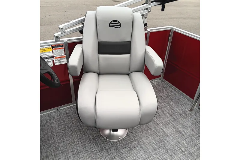 Slide: The Image of 2026 Sun Tracker Party Barge 16 DLX captain's chair with gray upholstery and armrests. - 16