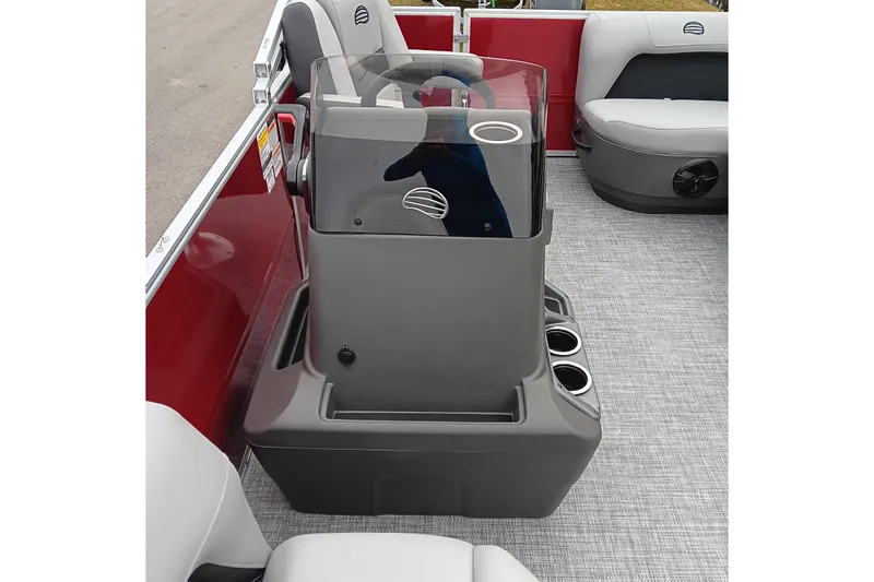 Slide: The Image of 2026 Sun Tracker Party Barge 16 DLX interior with steering console and seating. - 17